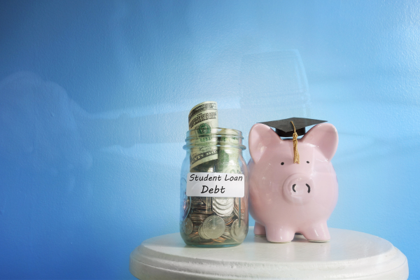 Piggy Bank in graduation cap next to jar full of money labeled