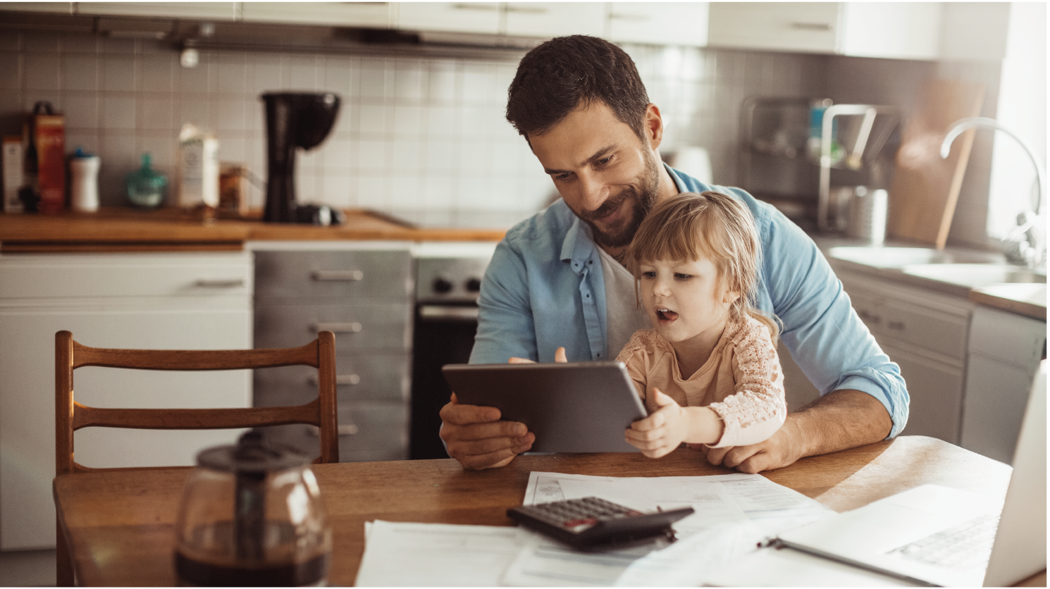 Crystal Lake Chamber Email r2-05 Dad on tablet and kitchen table with young daughter