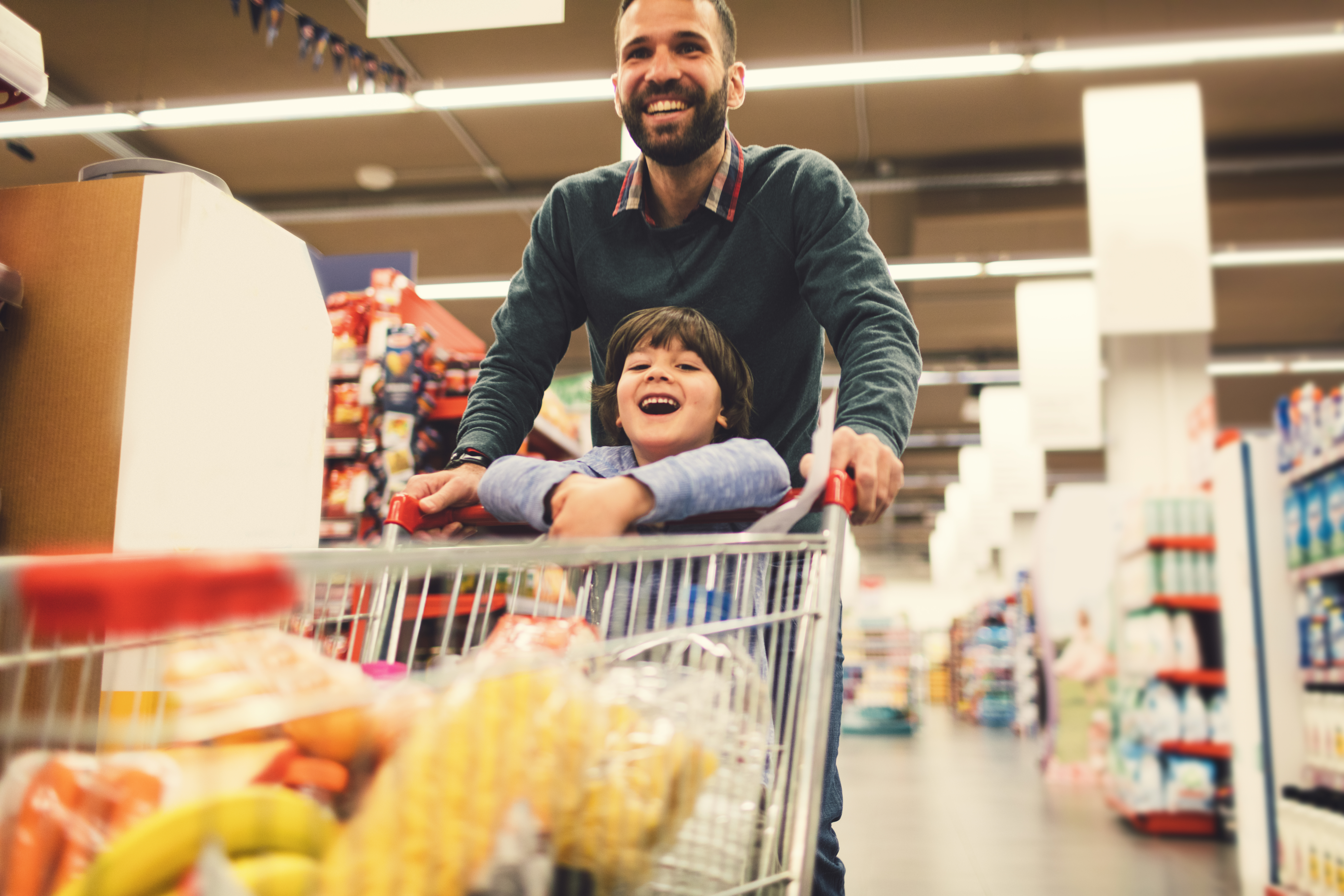 GettyImages-658862806 Happy Dad and Son grocery shopping