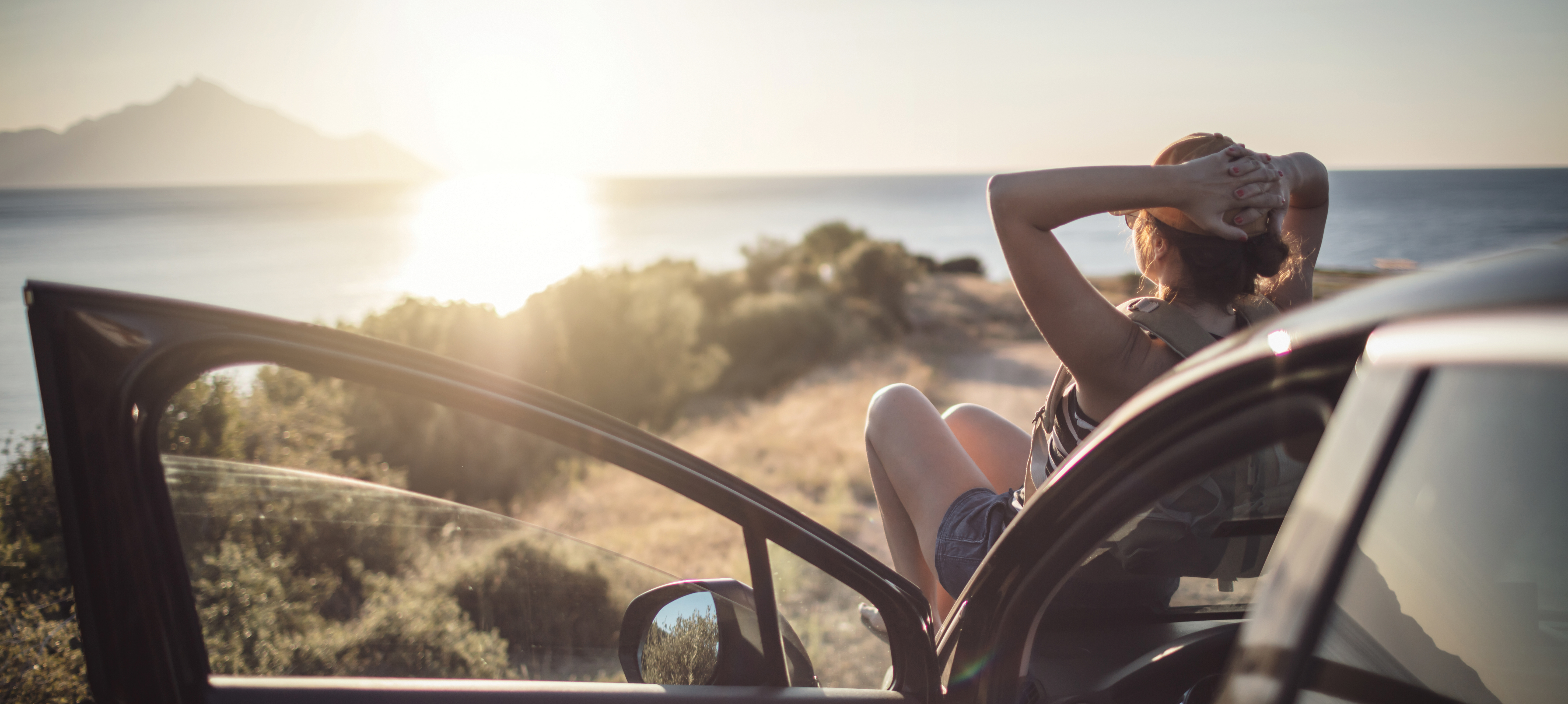 GettyImages-Person Person on Car Relaxing